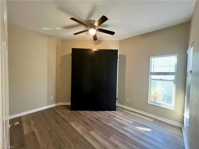 Unfurnished bedroom featuring light wood finished floors and ceiling fan