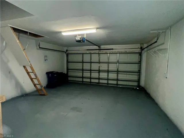 Garage featuring a garage door opener