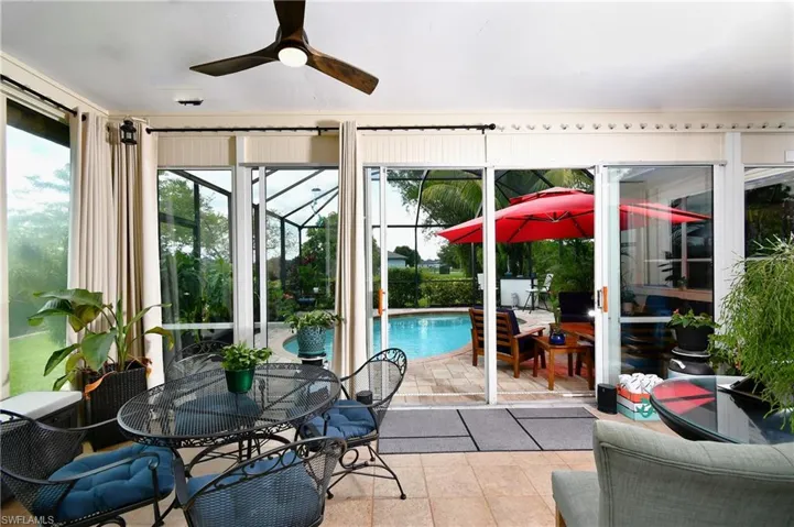 Sunroom featuring plenty of natural light and ceiling fan