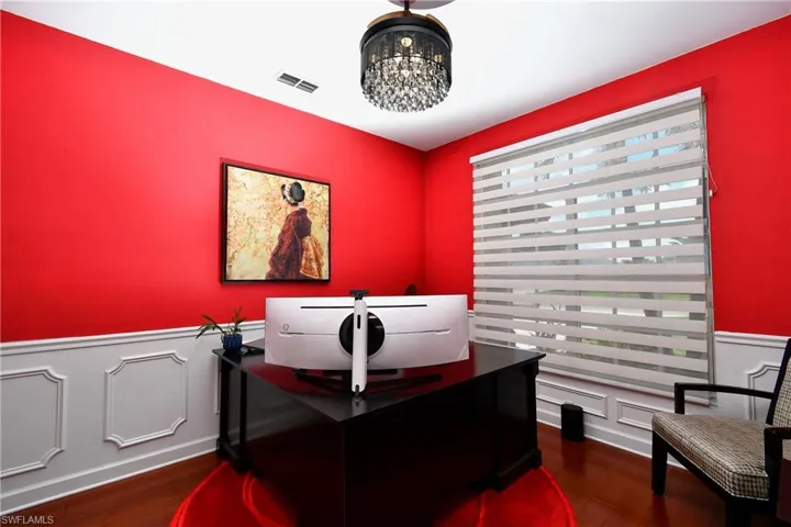 Office area featuring an inviting chandelier, plenty of natural light, and engineered wood bamboo flooring