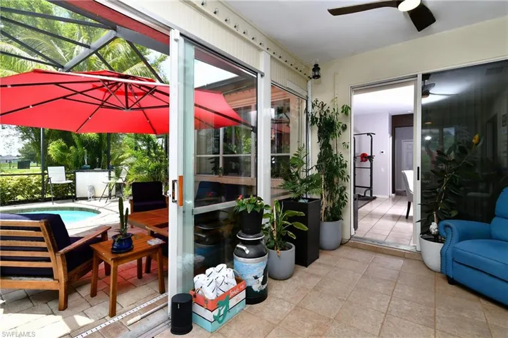 Sunroom / solarium featuring ceiling fan
