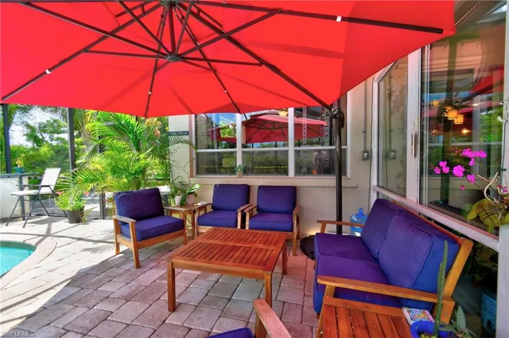 View of outdoor lounge area poolside