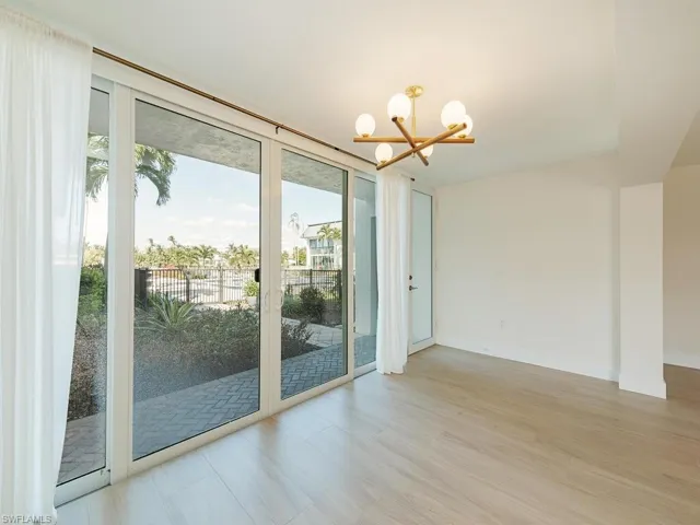 From Living Room towards Court Yard Community Pool and Bay