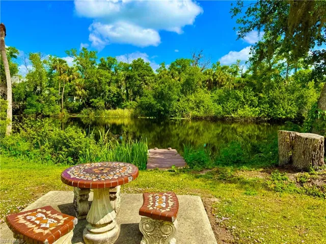 View of yard with a water view