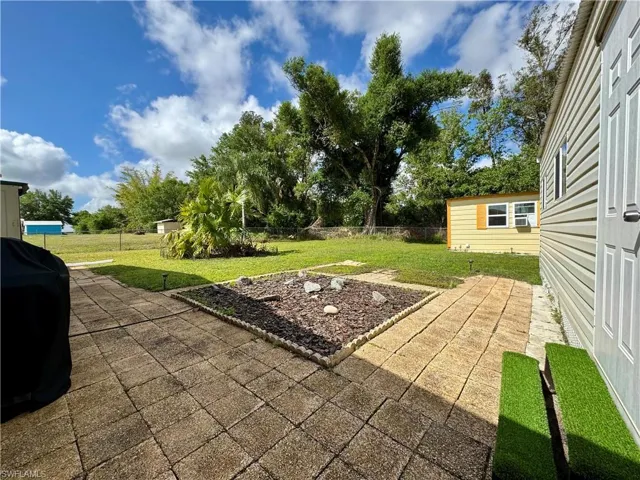 View of patio / terrace featuring a fenced backyard and a grill