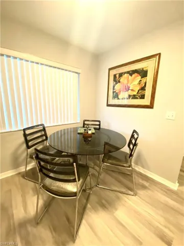 Dining space with wood-type flooring