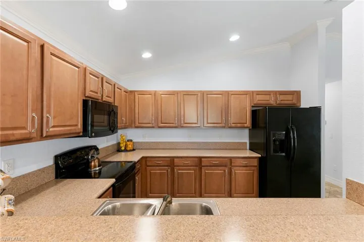 Kitchen with ample cabinets and countertop space.