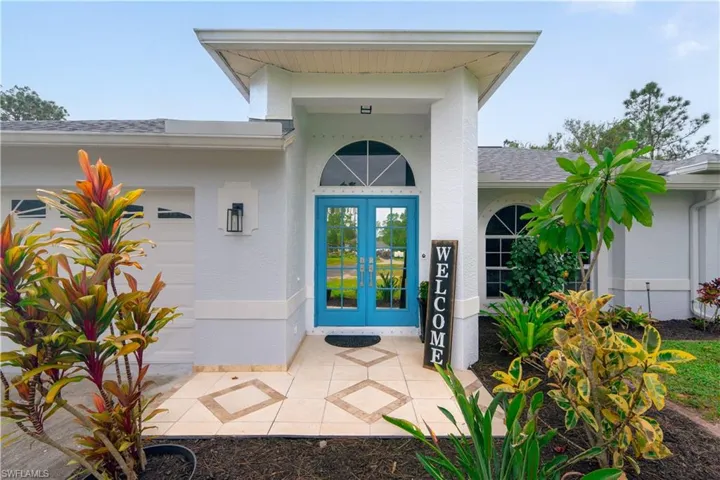 Entrance to property with french doors and a garage