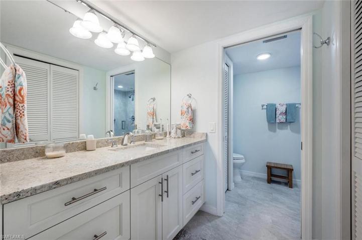 Primary bath vanity and closet area