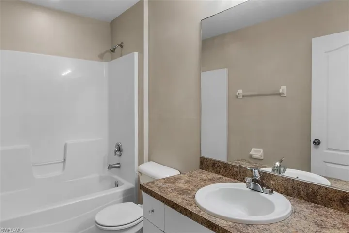 Bathroom featuring shower / bathtub combination and vanity