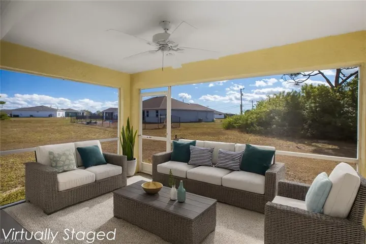 Sunroom / solarium with a ceiling fan, an outdoor hangout area, and healthy amount of natural light