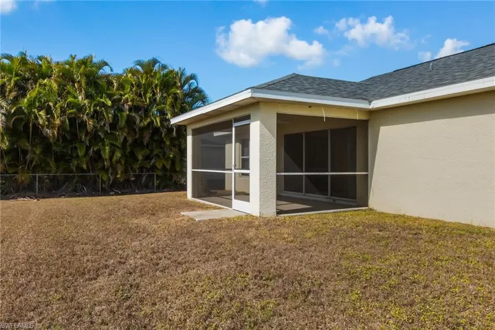 View of yard with a sunroom