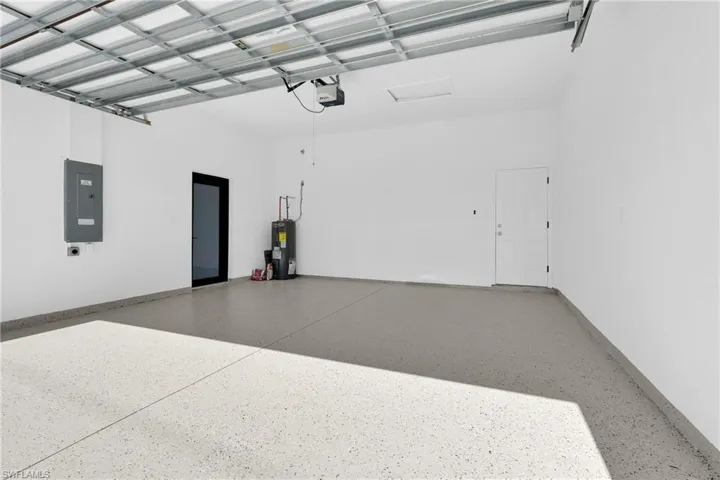 Garage with electric panel and water heater
