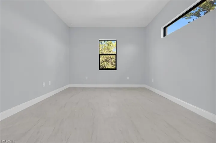Spare room featuring plenty of natural light