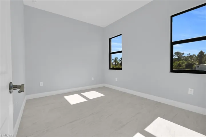 Spare room featuring baseboards