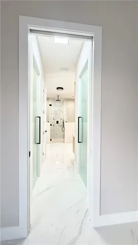 Hall with marble tiled flooring