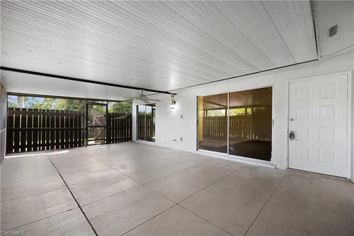 View of patio / terrace featuring ceiling fan and a gate