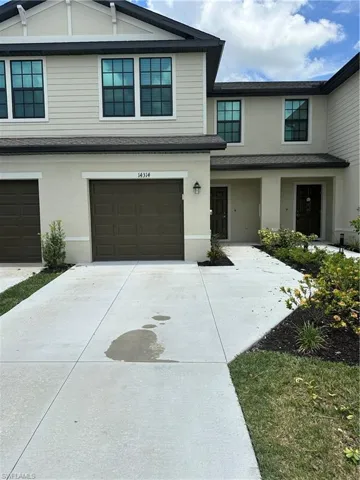 View of property with a garage