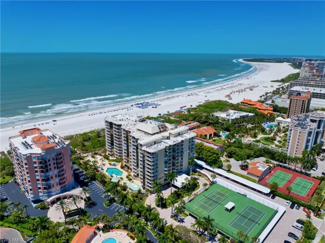 View of urban area with a pool and expansive beach