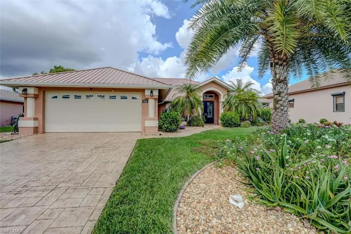 View of front of property with a garage