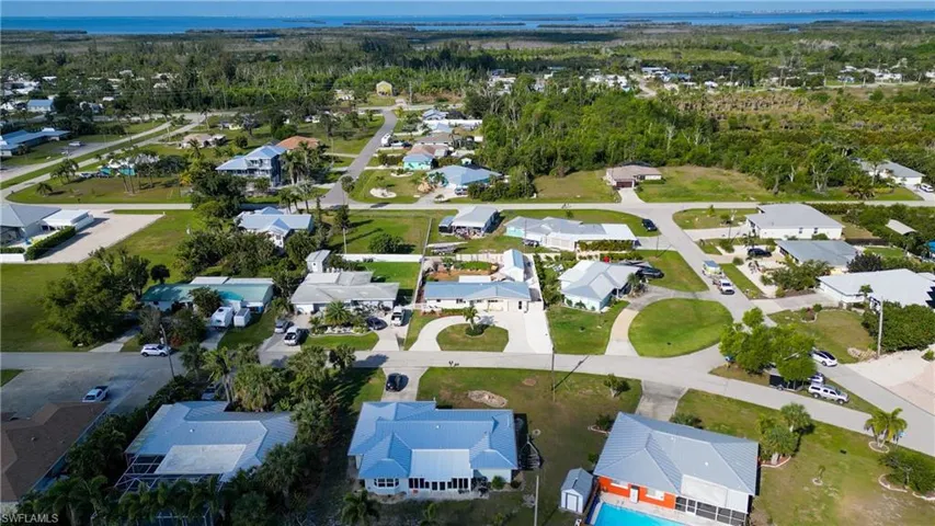 Aerial view of residential area with a large body of water