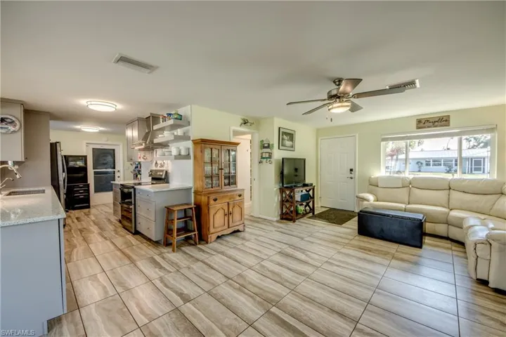 Living area featuring a ceiling fan