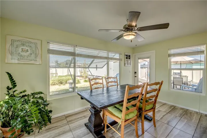 Dining space featuring baseboards and a ceiling fan