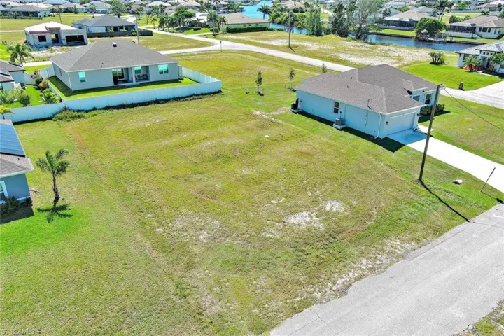 Aerial view of residential area with a nearby body of water