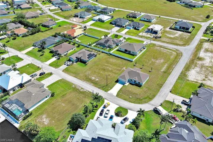 Aerial overview of property's location featuring nearby suburban area
