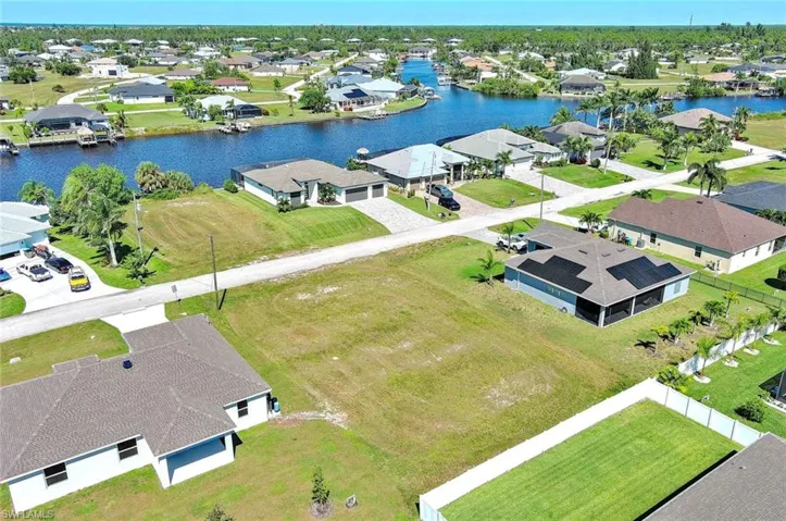 Aerial view of residential area with a nearby body of water