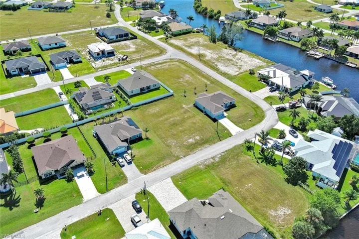 Aerial view of residential area with a nearby body of water