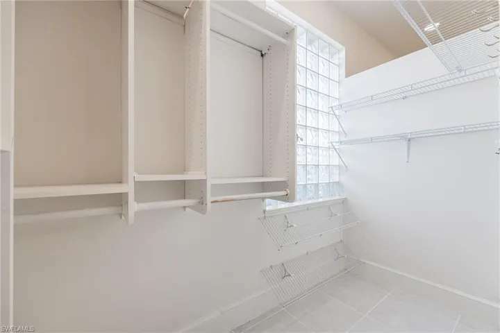 Walk in closet featuring light tile patterned floors