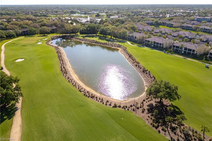 Drone / aerial view of a large body of water and a golf club