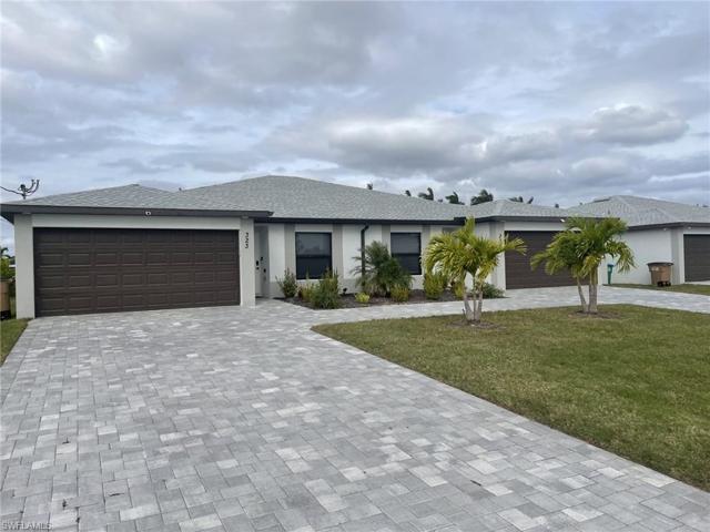 Paver Driveway with Two Car Garages on each side