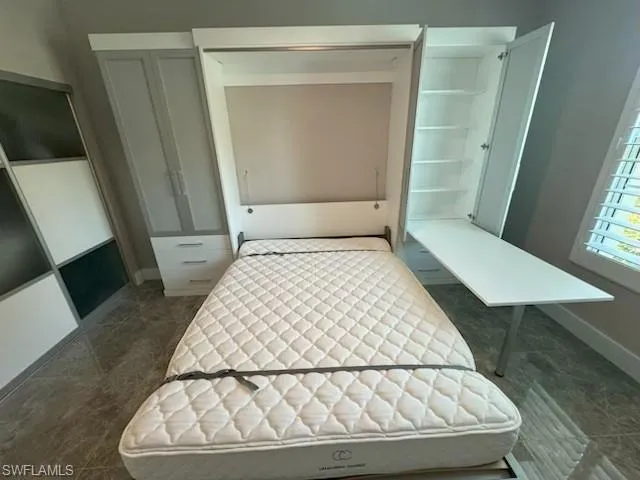 Bedroom with baseboards