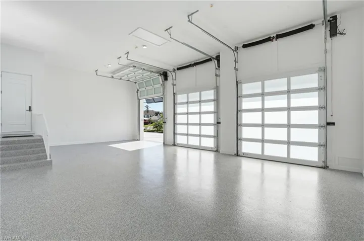 Garage featuring baseboards