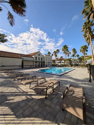 Community pool with a patio area