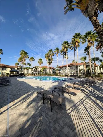 Community pool featuring a patio