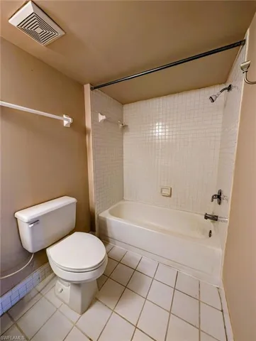 Bathroom featuring shower / washtub combination and tile patterned floors