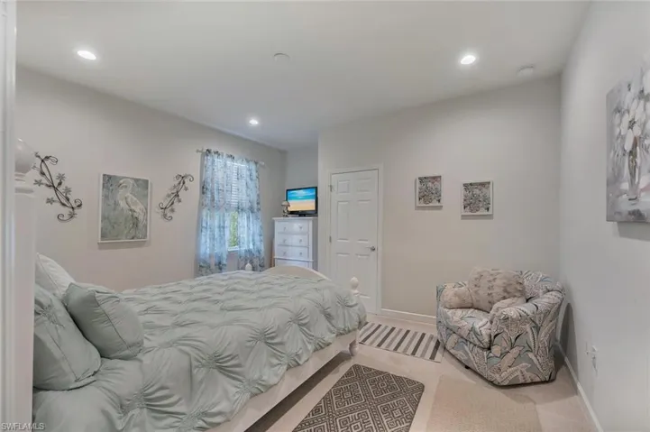 Carpeted bedroom featuring baseboards and recessed lighting