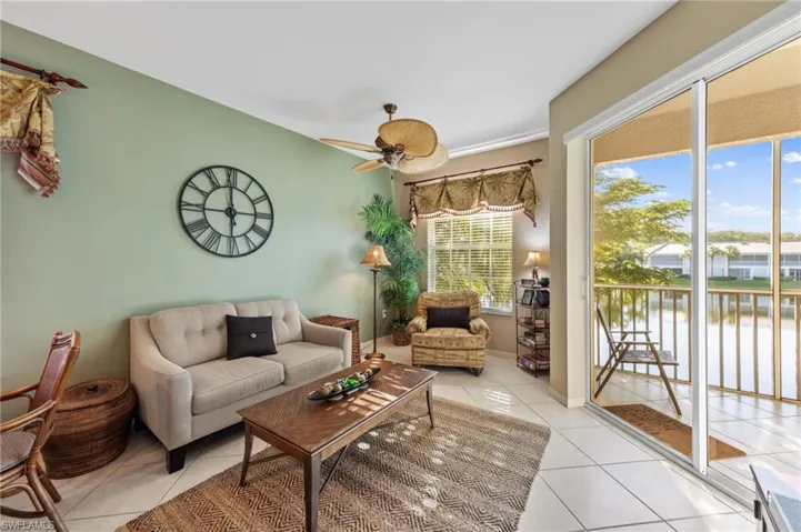 Sitting area off Kitchen with Sliding doors to screened Lanai space with water view.