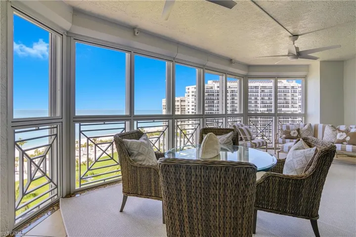 A spacious and serene gathering spot facing the Park Shore park, beach path, and beach