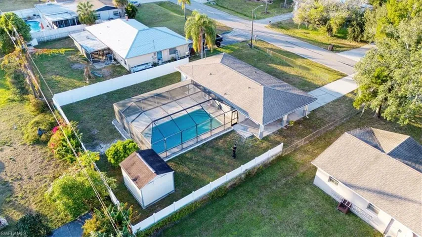 Aerial perspective of suburban area featuring a pool area