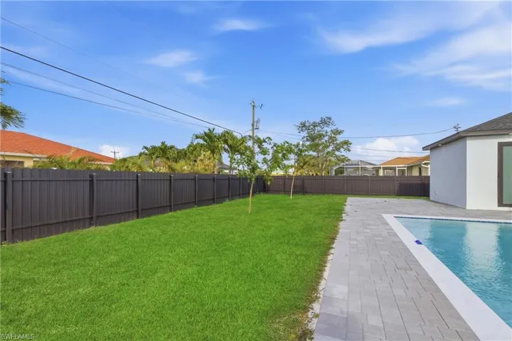 Fenced backyard featuring a patio