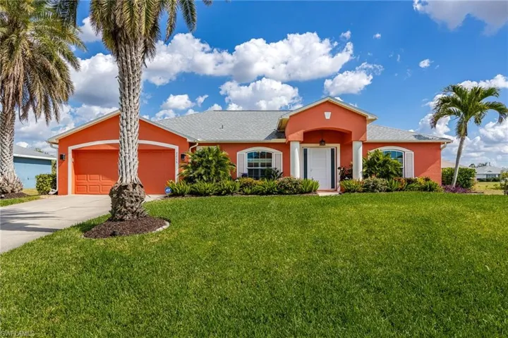 Beautifully maintained home with lush tropical landscaping