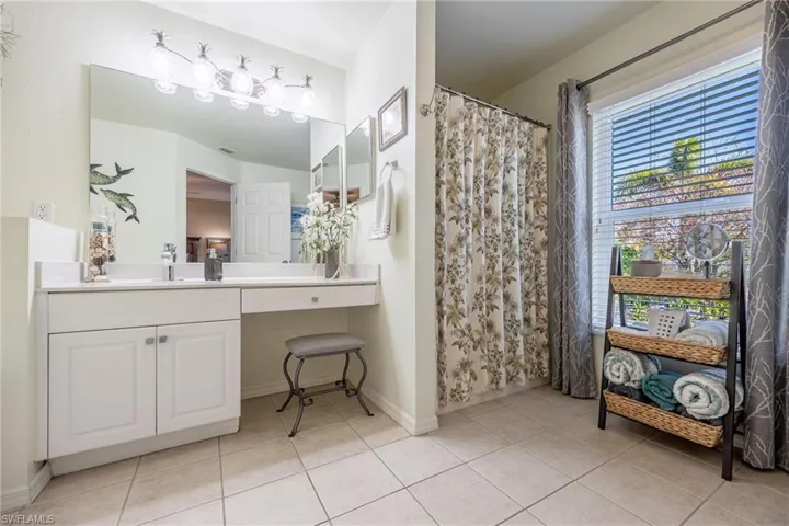 Primary bathroom with separate shower, sink & vanity space