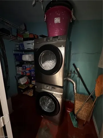 Laundry area featuring stacked washer / dryer