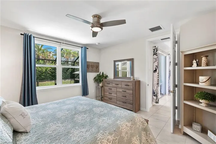 Bedroom featuring ceiling fan and light tile patterned floors