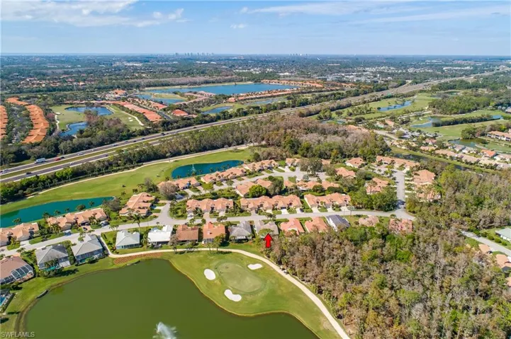 View of property location featuring a nearby body of water and nearby suburban area