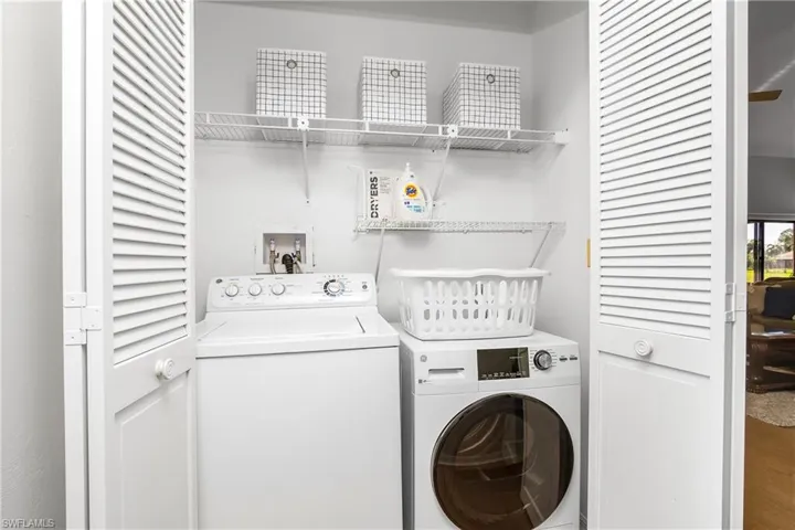 Laundry area featuring separate washer and dryer